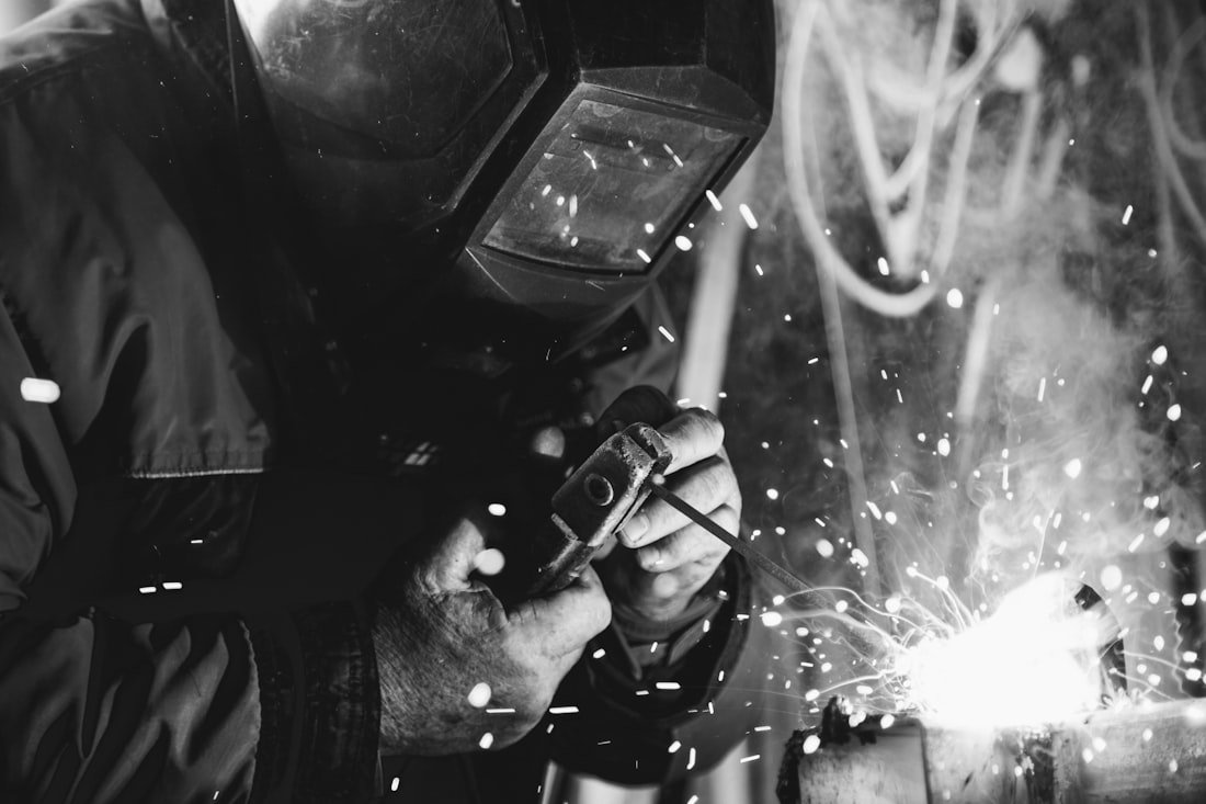 A welder at work amid sparks.